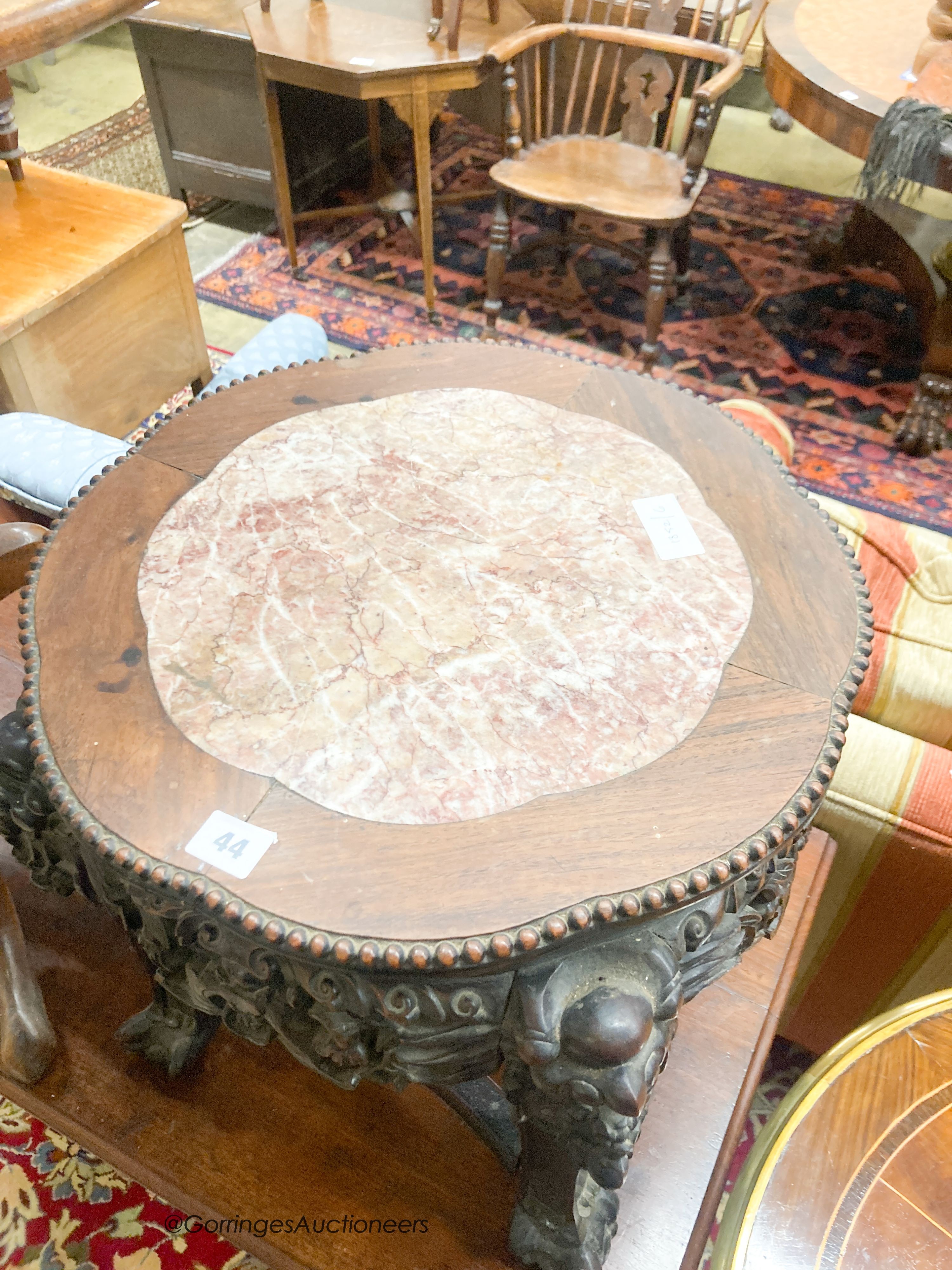 A Chinese carved hardwood jardiniere stand with rouge marble inset top, width 44cm, height 45cm